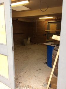 Peering inside the building on Jan 20th - Kitchen area with double doors in background 